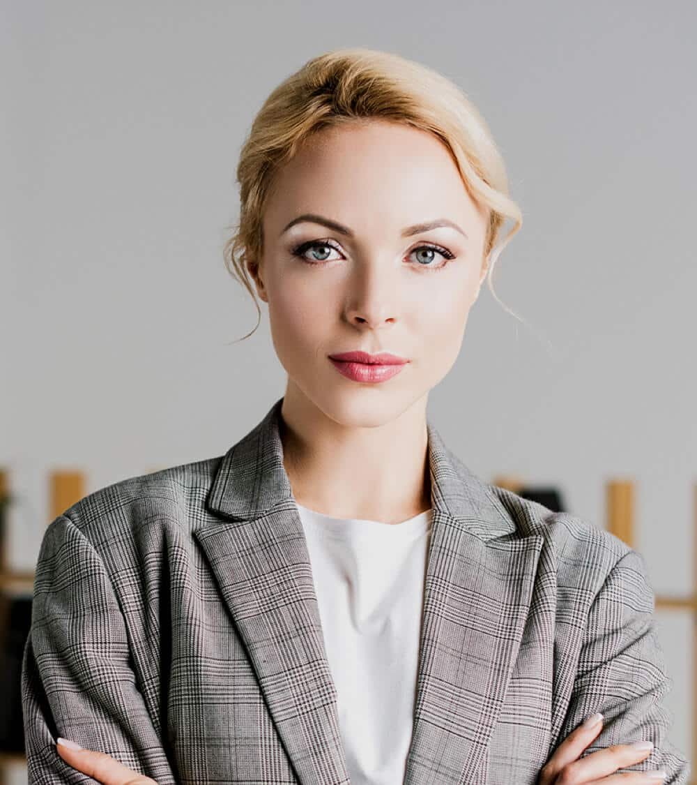 confident-businesswoman-standing-at-office-2023-11-27-05-05-19-utc.jpg